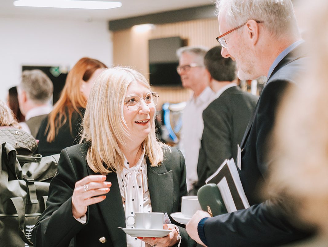 Two people talking at a Growing Together event